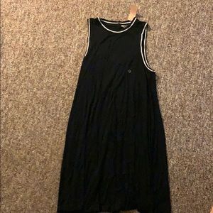 Dress still has tag. Open in the back